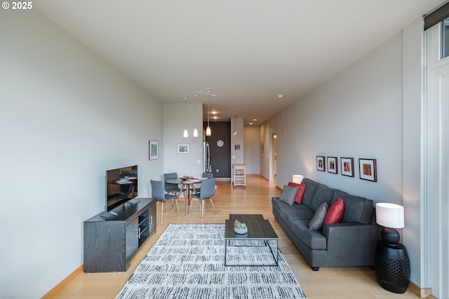 1255 NW 9th Ave Unit 508, Portland, OR 97209 - living room with light wood-type flooring and baseboards