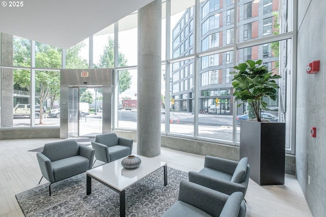 1255 NW 9th Ave Unit 508, Portland, OR 97209 - common area with a high ceiling and floor to ceiling windows
