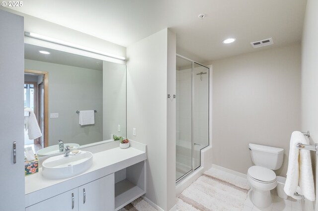 1255 NW 9th Ave Unit 508, Portland, OR 97209 - bathroom with vanity, a shower stall, toilet, recessed lighting, and baseboards