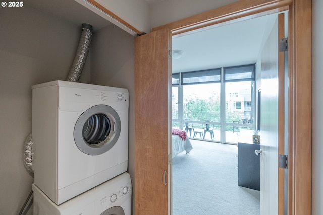 1255 NW 9th Ave Unit 508, Portland, OR 97209 - laundry room with carpet and stacked washer and clothes dryer