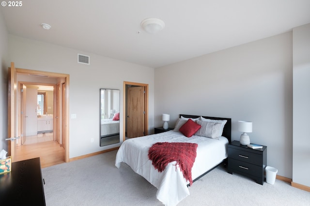 1255 NW 9th Ave Unit 508, Portland, OR 97209 - bedroom featuring baseboards and light carpet
