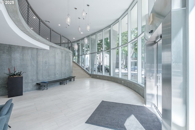 1255 NW 9th Ave Unit 508, Portland, OR 97209 - community lobby featuring floor to ceiling windows and a towering ceiling