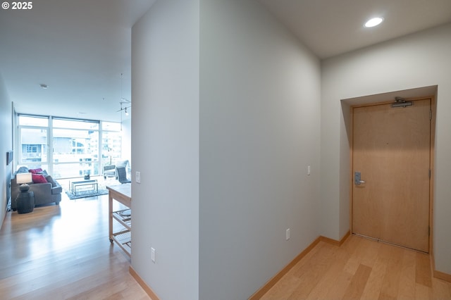 1255 NW 9th Ave Unit 508, Portland, OR 97209 - hallway featuring light wood-style floors, expansive windows, and recessed lighting