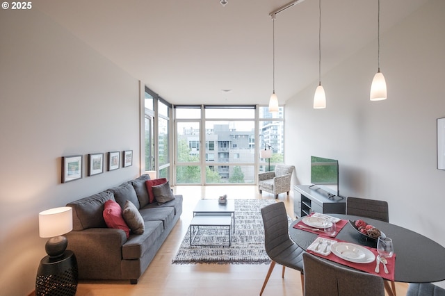 1255 NW 9th Ave Unit 508, Portland, OR 97209 - living room featuring a wall of windows and light wood-type flooring