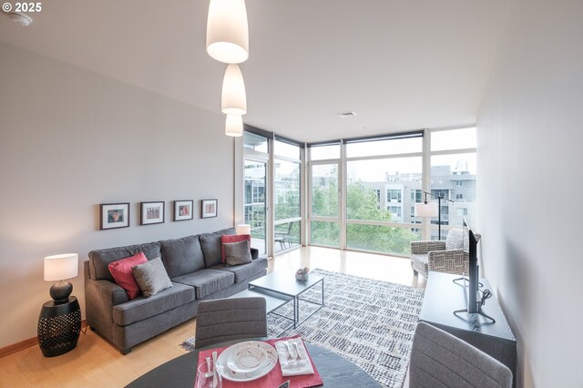 1255 NW 9th Ave Unit 508, Portland, OR 97209 - living area with expansive windows and wood finished floors