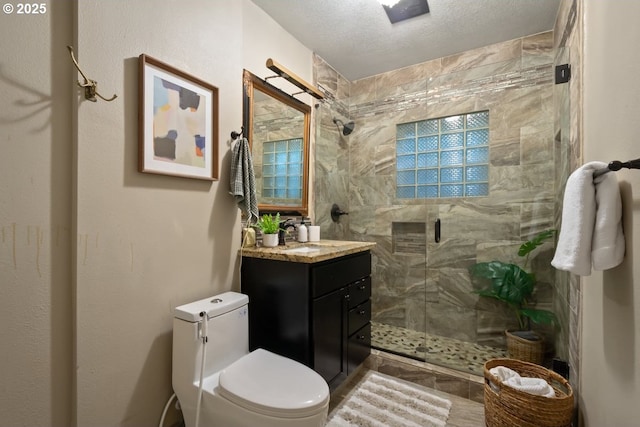 5005 NE Flanders St, Portland, OR 97213 - full bath featuring vanity, a stall shower, and a textured ceiling
