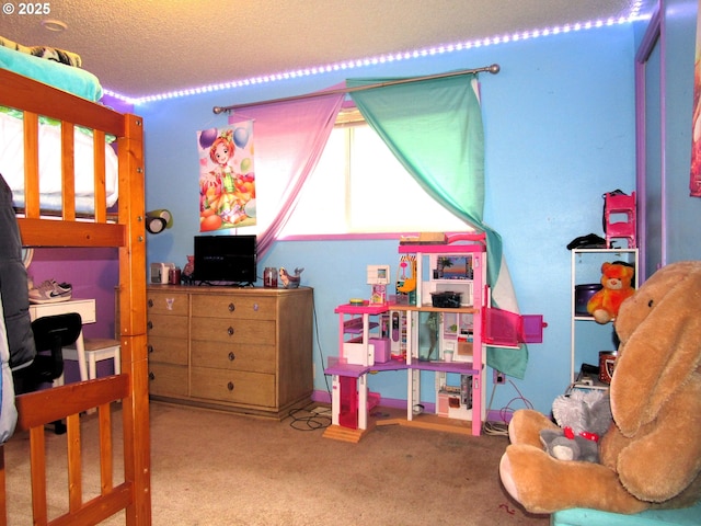 bedroom featuring a textured ceiling and carpet flooring