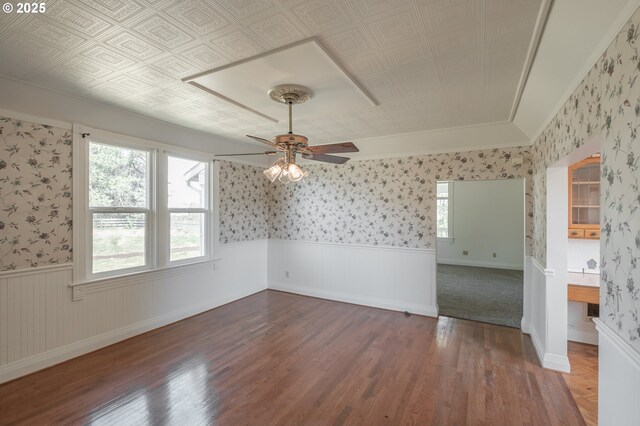 38588 Goar Rd, Scio, OR 97374 - spare room with wallpapered walls, wainscoting, ceiling fan, wood finished floors, and ornamental molding
