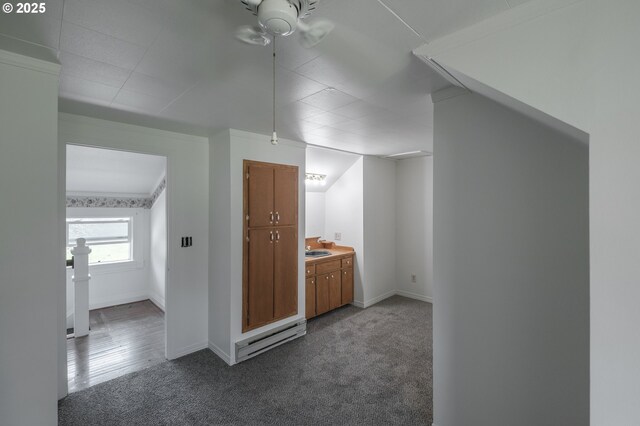 38588 Goar Rd, Scio, OR 97374 - bonus room with a baseboard heating unit, dark carpet, baseboards, ceiling fan, and a sink