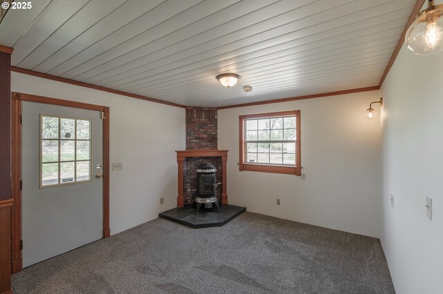 38588 Goar Rd, Scio, OR 97374 - unfurnished living room with carpet, crown molding, and a wood stove