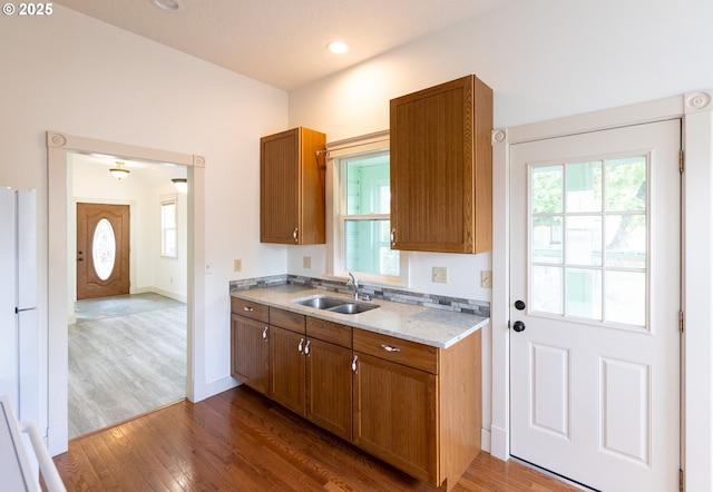 215 W 9th St, The Dalles, OR 97058 - kitchen featuring brown cabinetry and dark wood-type flooring