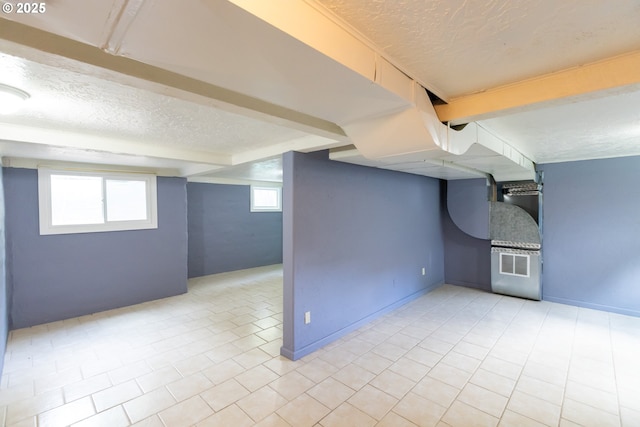 215 W 9th St, The Dalles, OR 97058 - basement with a textured ceiling and light tile patterned floors