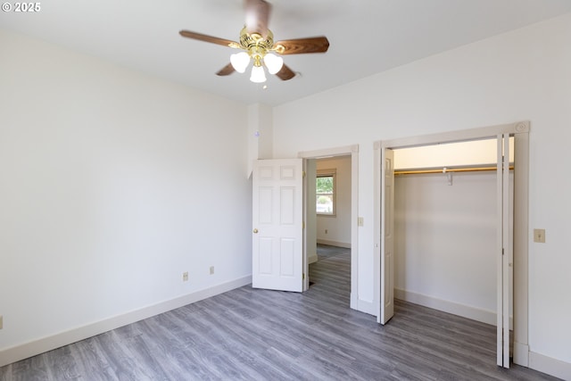215 W 9th St, The Dalles, OR 97058 - unfurnished bedroom with wood finished floors, a closet, and a ceiling fan