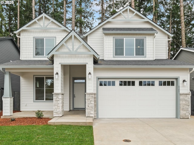 craftsman inspired home with stone siding, concrete driveway, a garage, and roof with shingles