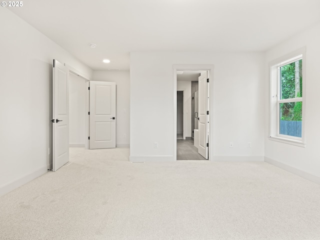 unfurnished bedroom with recessed lighting, baseboards, and carpet floors