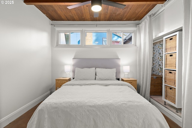 bedroom featuring multiple windows, wooden ceiling, and baseboards