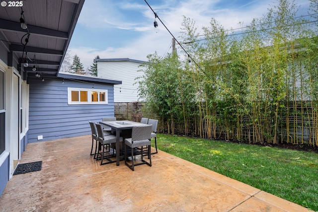 view of patio / terrace featuring outdoor dining space and a fenced backyard