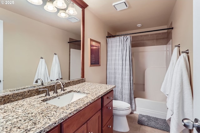 bathroom featuring tile patterned flooring, shower / tub combo, toilet, and vanity