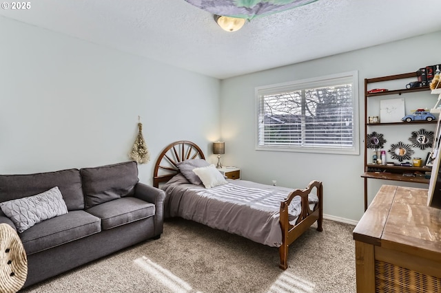 bedroom with carpet floors, a textured ceiling, and baseboards