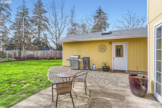 view of patio / terrace featuring a grill and fence