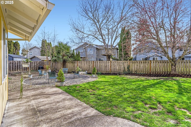 view of yard with a residential view, fence, and a patio