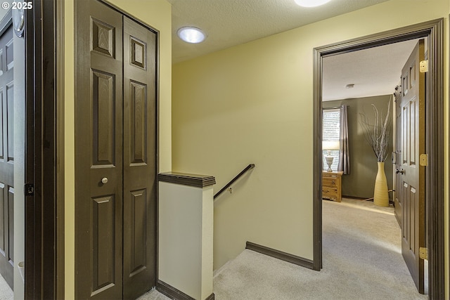 4422 SW Appletree Pl, Beaverton, OR 97078 - hall with an upstairs landing, light colored carpet, and a textured ceiling