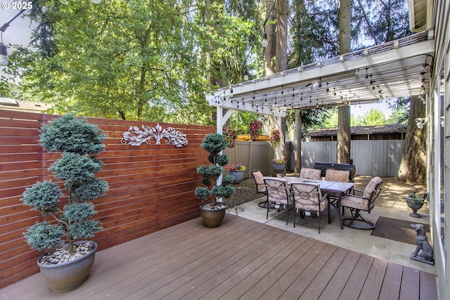 4422 SW Appletree Pl, Beaverton, OR 97078 - wooden terrace with outdoor dining area, a fenced backyard, and a pergola