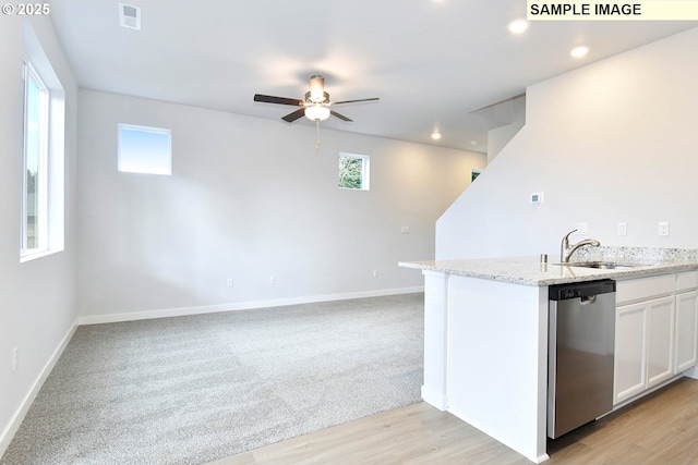 kitchen featuring a ceiling fan, visible vents, a sink, white cabinets, and stainless steel dishwasher