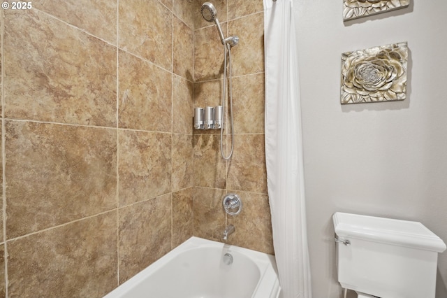 bathroom with shower / tub combo and toilet