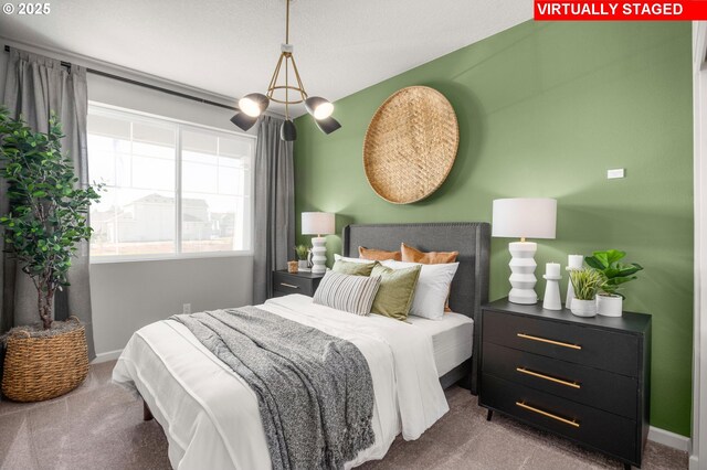 carpeted bedroom with a textured ceiling and a closet