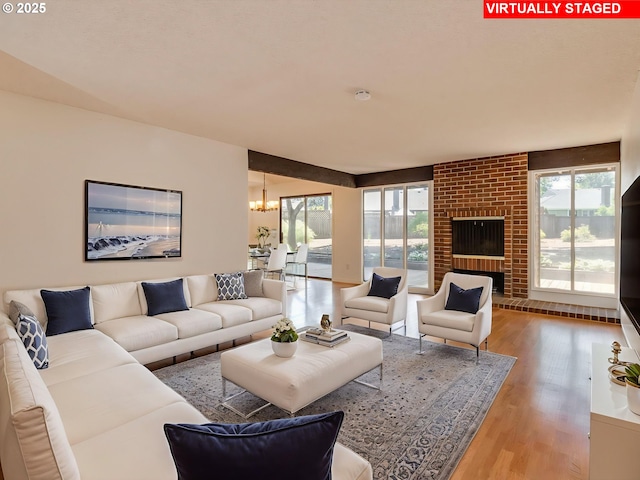 20270 SW Brightwood Ct, Beaverton, OR 97003 - living room with a chandelier and wood finished floors