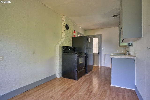 1641 Mabee Mines Rd Unit 4, Washougal, WA 98671 - kitchen featuring black appliances, light countertops, and light wood finished floors