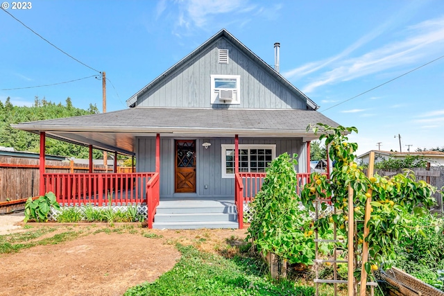 38058 Railroad Ln, Marcola, OR 97454 - view of front facade featuring a porch, roof with shingles, cooling unit, and board and batten siding