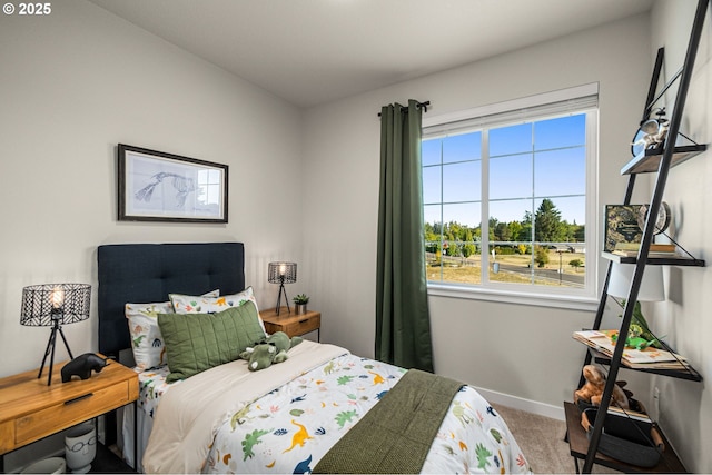 bedroom with baseboards, multiple windows, and carpet