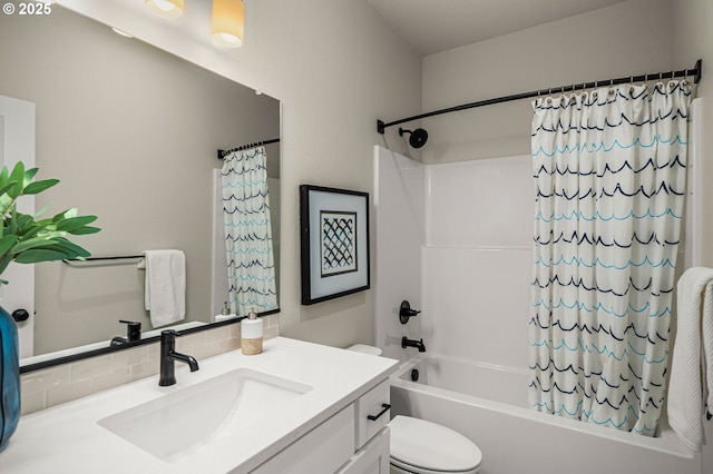bathroom featuring shower / bath combo with shower curtain, vanity, toilet, and tasteful backsplash