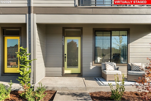 view of exterior entry with covered porch