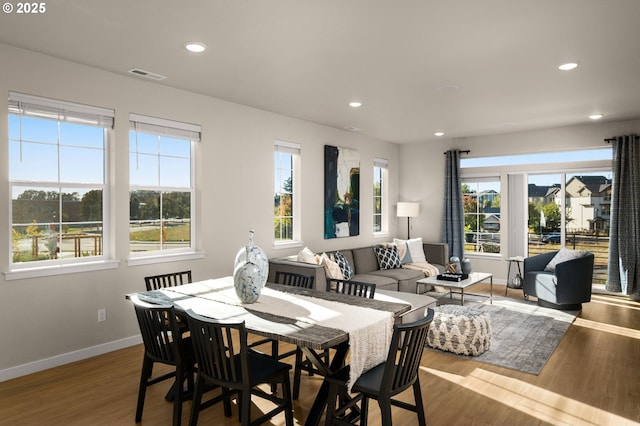 dining space featuring baseboards, recessed lighting, wood finished floors, and visible vents