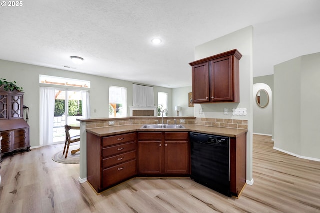 4908 Holly St, Springfield, OR 97478 - kitchen featuring black dishwasher, light wood finished floors, plenty of natural light, and a peninsula