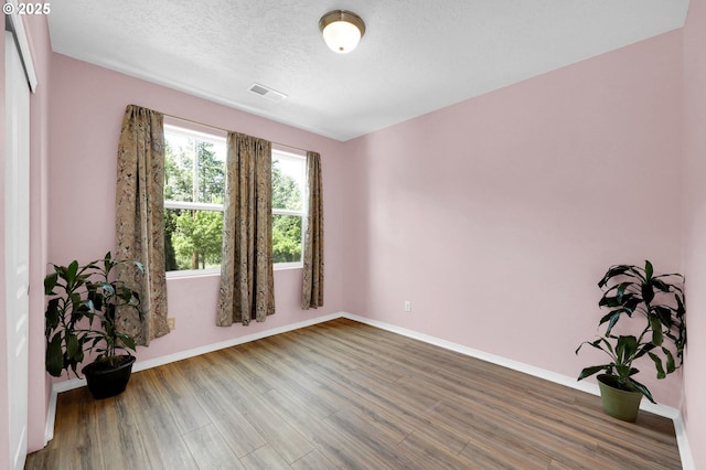 4908 Holly St, Springfield, OR 97478 - unfurnished room with wood finished floors and a textured ceiling