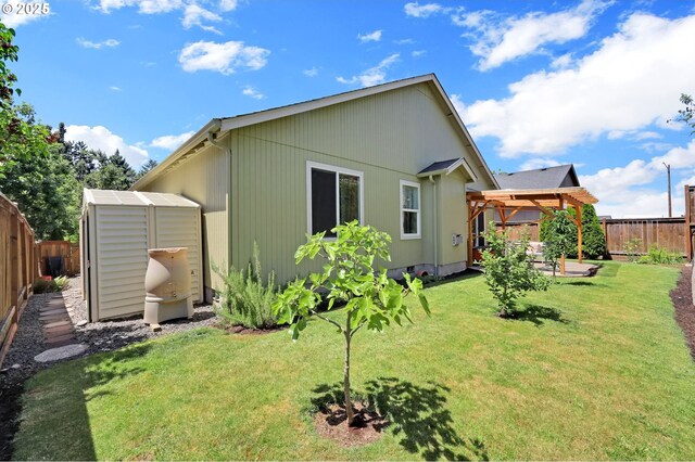 4908 Holly St, Springfield, OR 97478 - back of house with a fenced backyard, a gazebo, a storage unit, and a patio