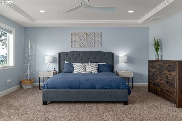 carpeted bedroom with crown molding, baseboards, a tray ceiling, and recessed lighting