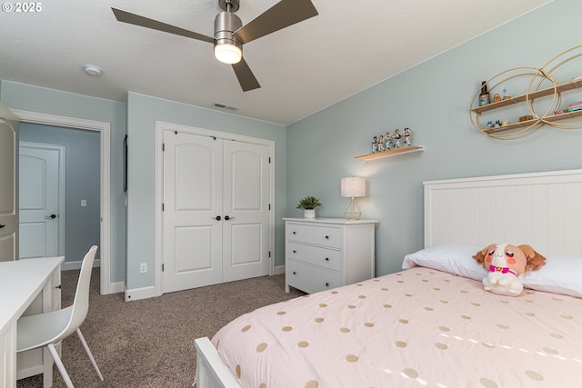 carpeted bedroom featuring visible vents, baseboards, ceiling fan, and a closet