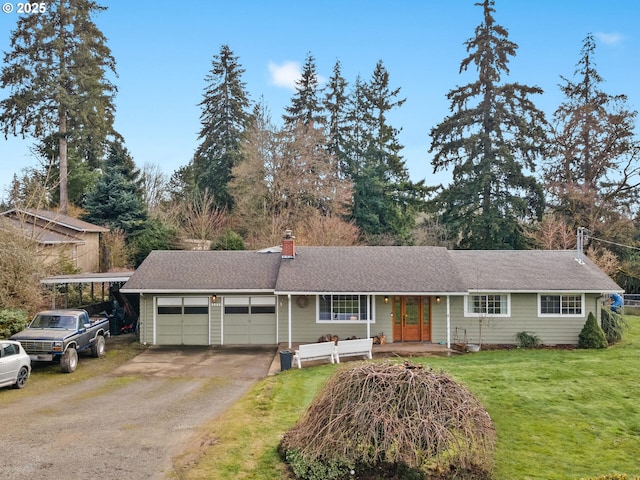 ranch-style house with a garage, covered porch, and a front lawn