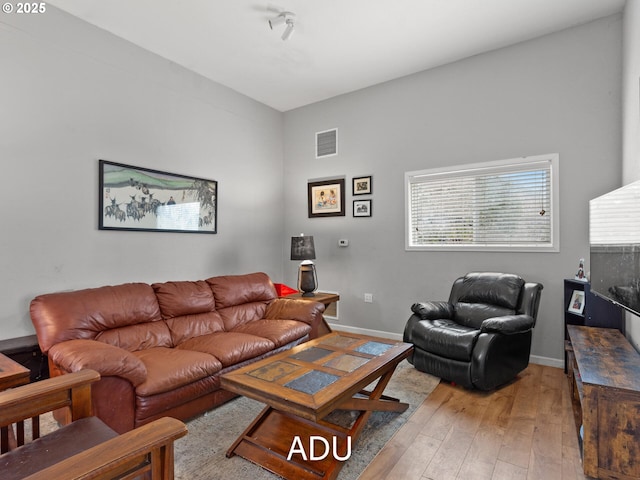 living room with light hardwood / wood-style floors