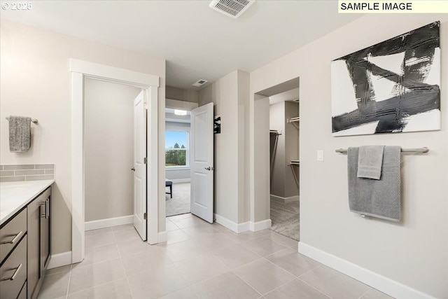 bathroom with vanity and tile patterned flooring