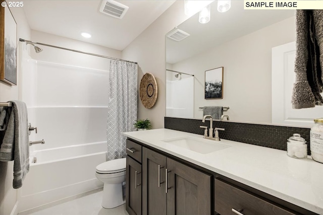 full bathroom featuring shower / tub combo with curtain, vanity, and toilet