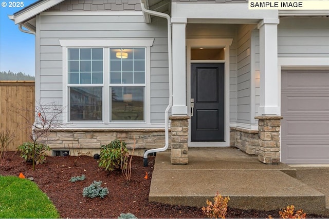 entrance to property featuring a garage