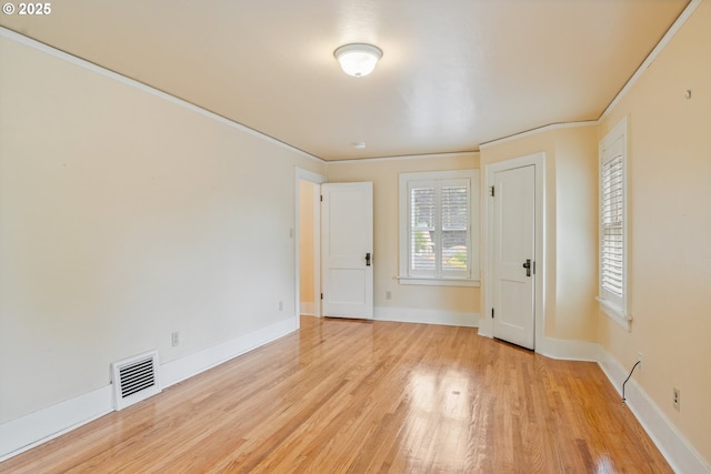 1702 24th Ave, Longview, WA 98632 - spare room featuring light wood-type flooring and ornamental molding