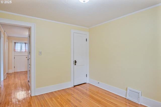 1702 24th Ave, Longview, WA 98632 - empty room with light wood-type flooring and crown molding