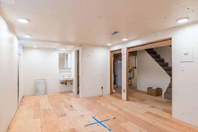 1702 24th Ave, Longview, WA 98632 - finished basement with wood finished floors, stairs, secured water heater, and recessed lighting